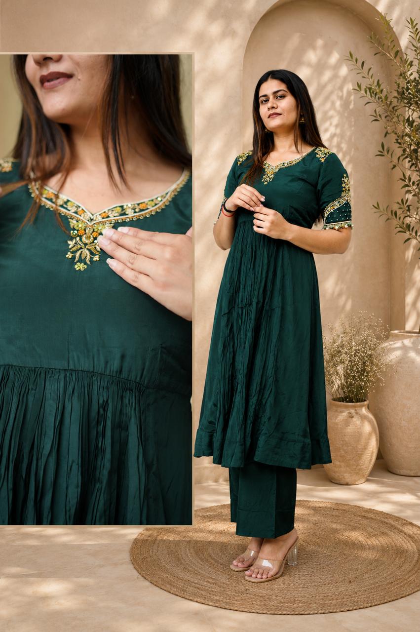 Emerald green Anarkali kurta set with embroidered neckline detail and matching pants