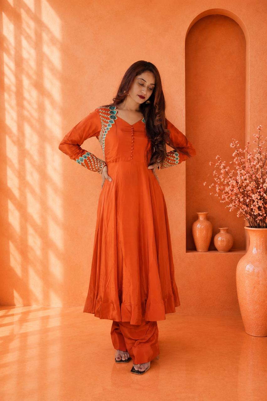 Rust orange embroidered kurta pant set for women with detailed neckline and sleeves