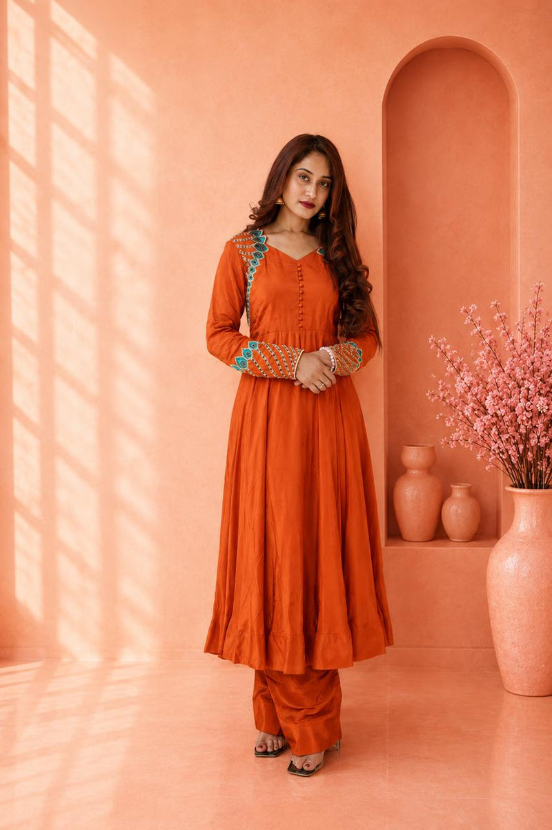Rust orange embroidered kurta pant set for women with turquoise detailing