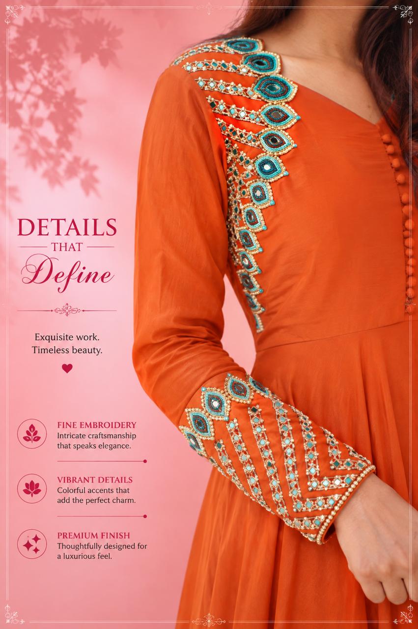 Close-up of rust orange kurta with turquoise and gold embroidered neckline and sleeve detailing