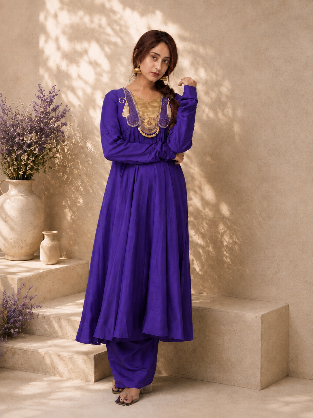 Full-length royal purple Anarkali kurta set with gold embroidery and matching pants